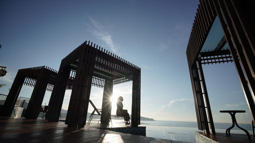 Low angle view of silhouette building against sky