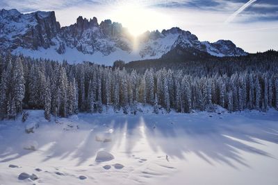 Scenic view of snow covered mountains against sky