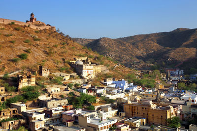 High angle view of residential district by mountains and amer fort