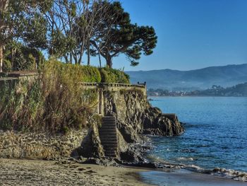 Scenic view of sea against clear blue sky