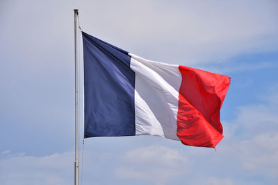 Low angle view of french flag against sky