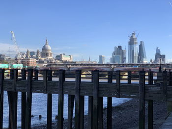 Bridge over river with buildings in background