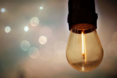 Close-up of illuminated light bulb