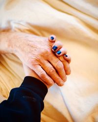 High angle view of man holding hands