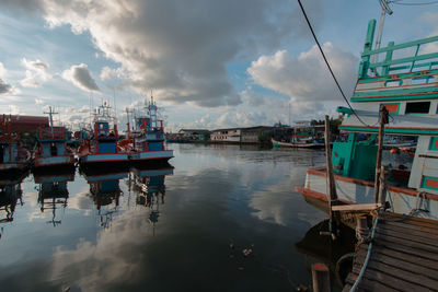 Boats moored at harbor