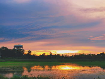 Scenic view of lake against sky during sunset