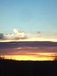 Scenic view of silhouette landscape against sky during sunset