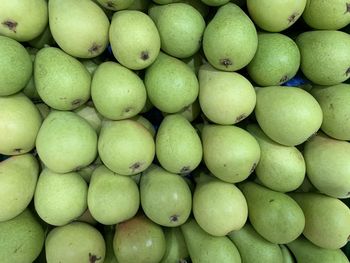 Full frame shot of pears  for sale in market