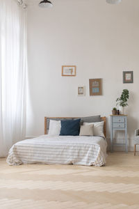 Interior of white and gray cozy bedroom