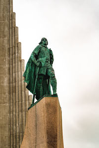 Low angle view of statue against sky