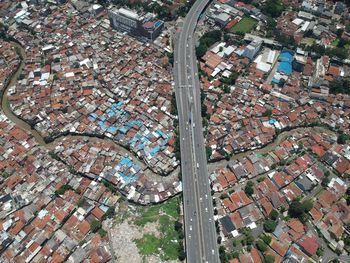 High angle view of road amidst buildings in town