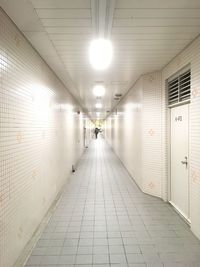 Diminishing perspective of illuminated corridor