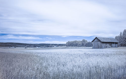 House on field against sky