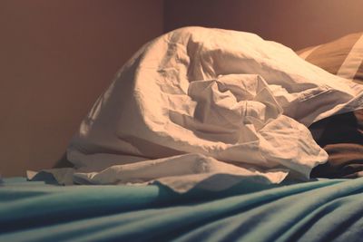 Close-up of blanket on bed at home