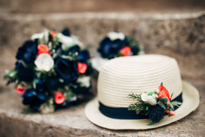 Close-up of hat with flowers on steps