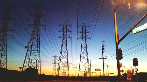 Electricity pylons at sunset