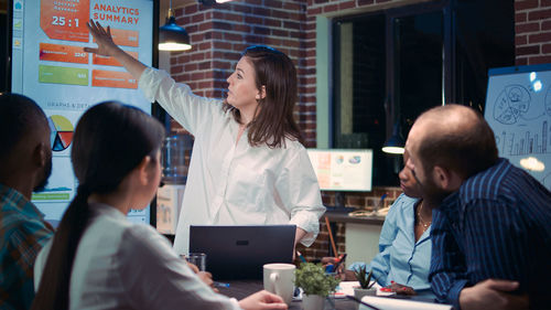 Group of business colleagues working at office