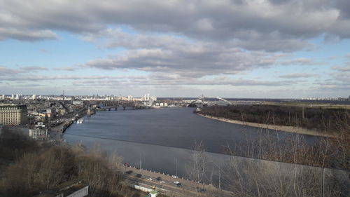 High angle view of river by buildings against sky