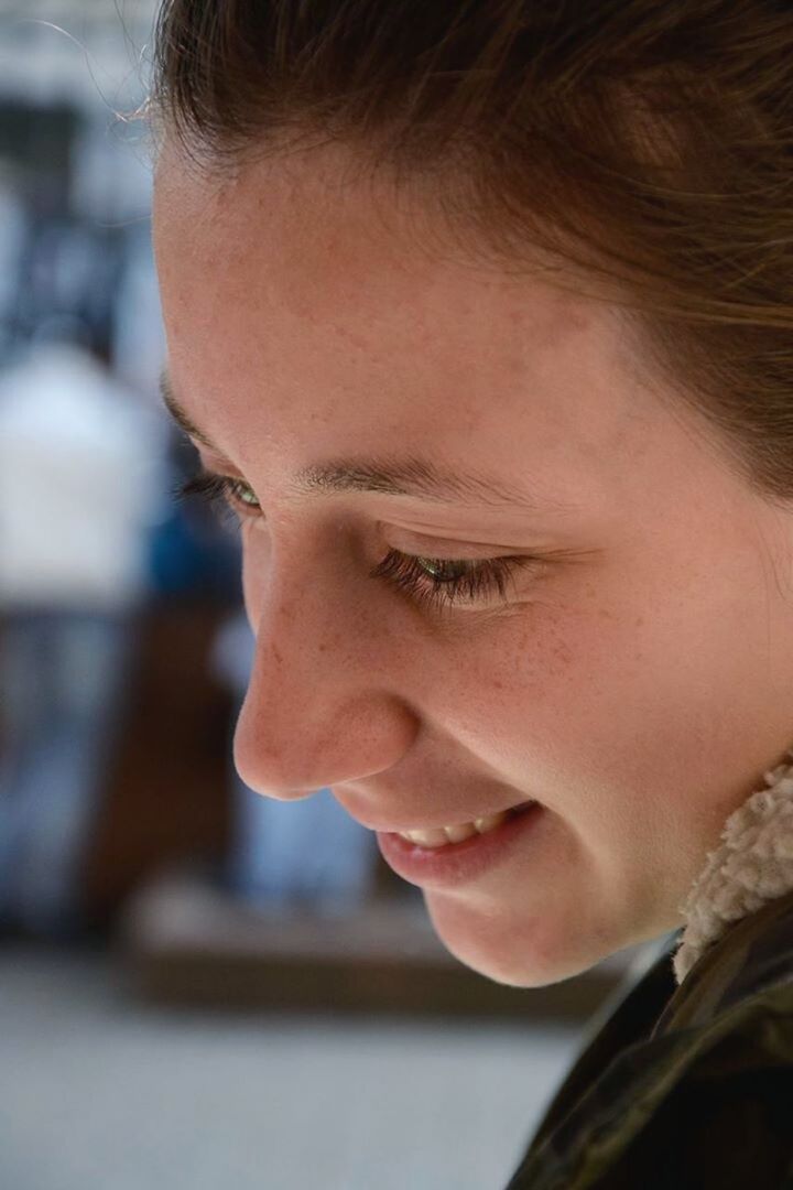 headshot, person, close-up, lifestyles, human face, indoors, leisure activity, looking at camera, focus on foreground, childhood, front view, young adult, portrait, head and shoulders, innocence, contemplation, elementary age