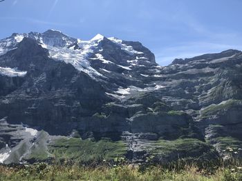 Scenic view of snowcapped mountains against sky