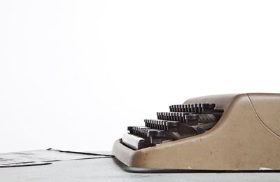 Close-up of piano over white background