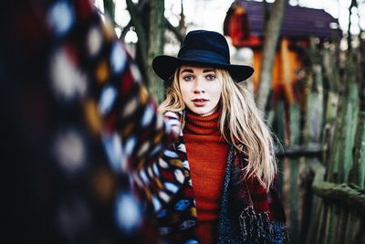 Portrait of young woman in hat