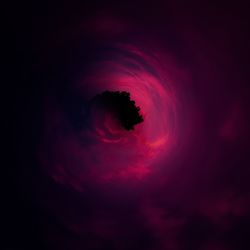 Low angle view of silhouette moon against sky at night