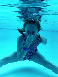 Girl swimming in pool