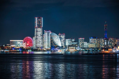 Illuminated city at waterfront