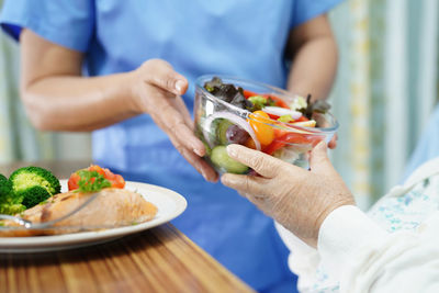 Midsection of man having food