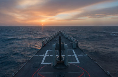 Nautical vessel on sea during sunset