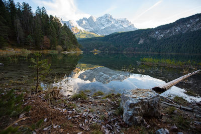 Scenic view of lake and mountains against sky