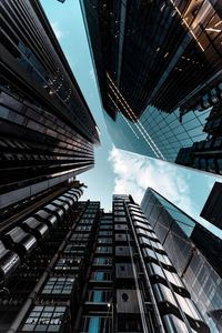 Low angle view of modern buildings against sky