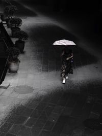 High angle view of woman walking on floor