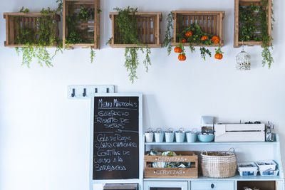 Blackboard with menu under cabinets at cafe