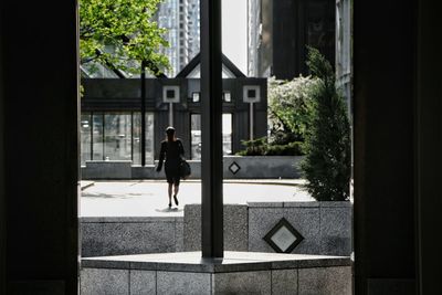 Man standing by window