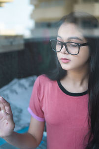 Portrait of young woman wearing sunglasses