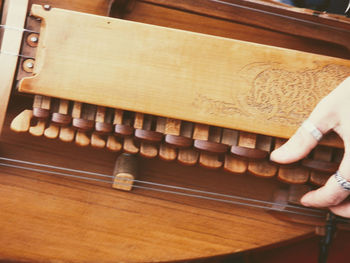 High angle view of person playing piano