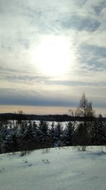 Scenic view of snow covered landscape against sky