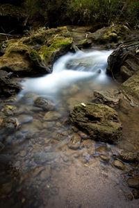 Stream flowing through rocks