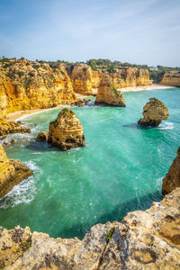 Vertical photography of spectacular cliffs near marinha beach and benagil in algarve, portugal