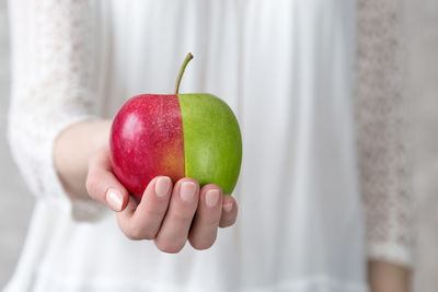 Close-up of hand holding strawberry