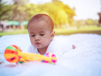 Portrait of cute boy with toy