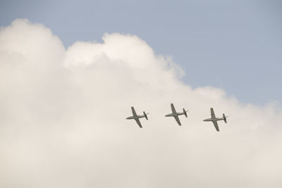 Low angle view of airplane flying in sky