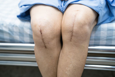 Low section of woman wearing shoes