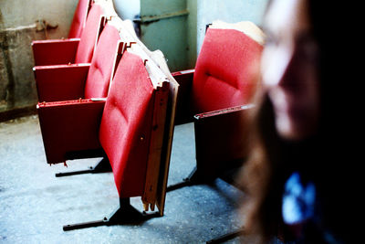 High angle view of red abandoned seats in room