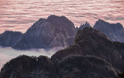 Scenic view of rock formation against sky during sunset