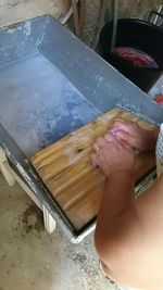 High angle view of man working in kitchen