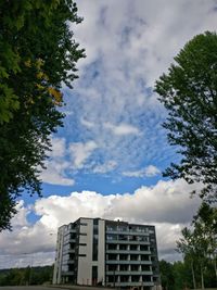 Low angle view of building against cloudy sky