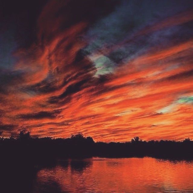 sunset, tranquil scene, scenics, sky, water, tranquility, beauty in nature, silhouette, orange color, waterfront, idyllic, cloud - sky, nature, lake, dramatic sky, reflection, cloud, cloudy, tree, outdoors